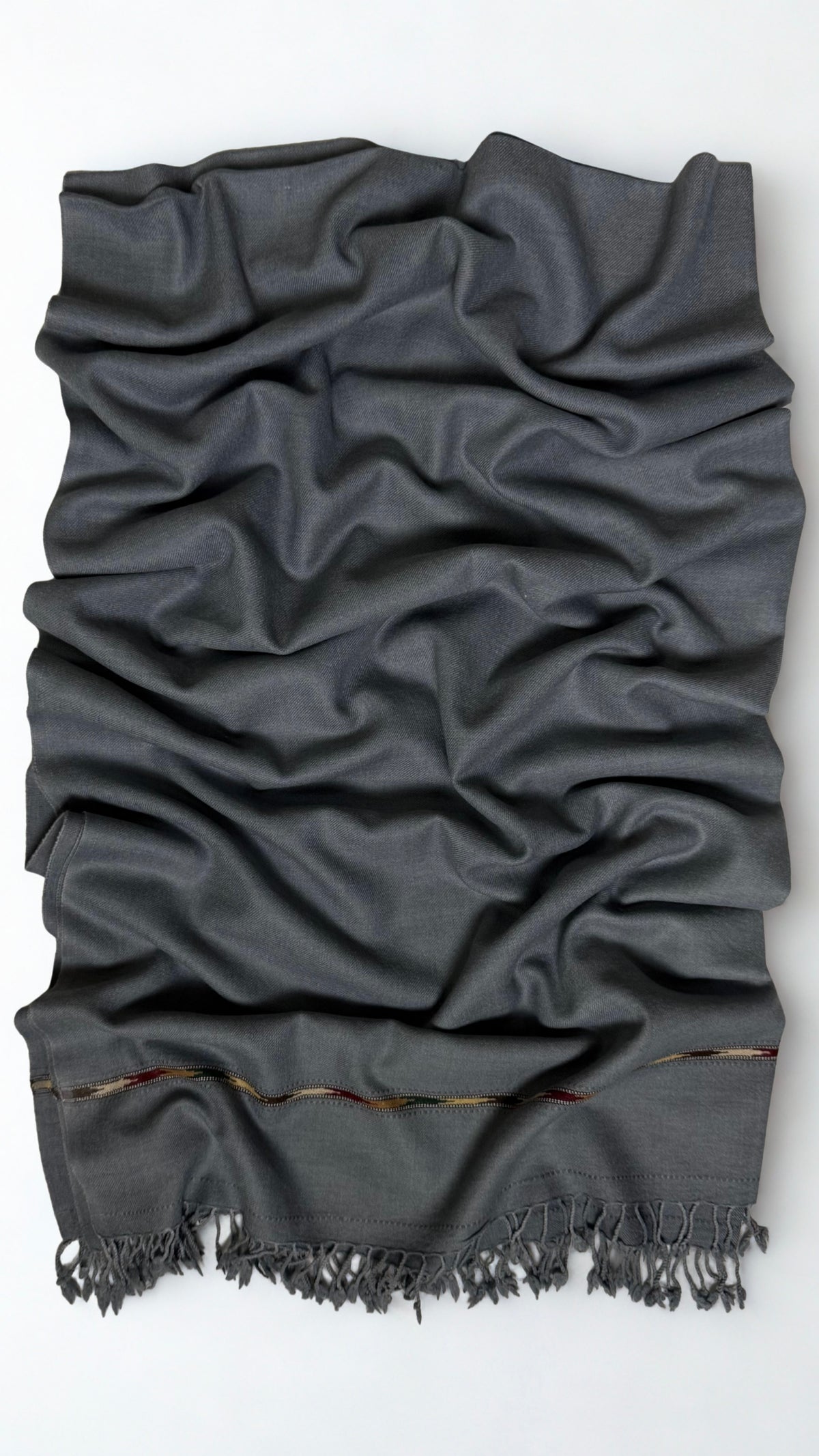 Grey men's Swati pashmina shawl laid out full length, plain 64-count wool weave with a woven end band