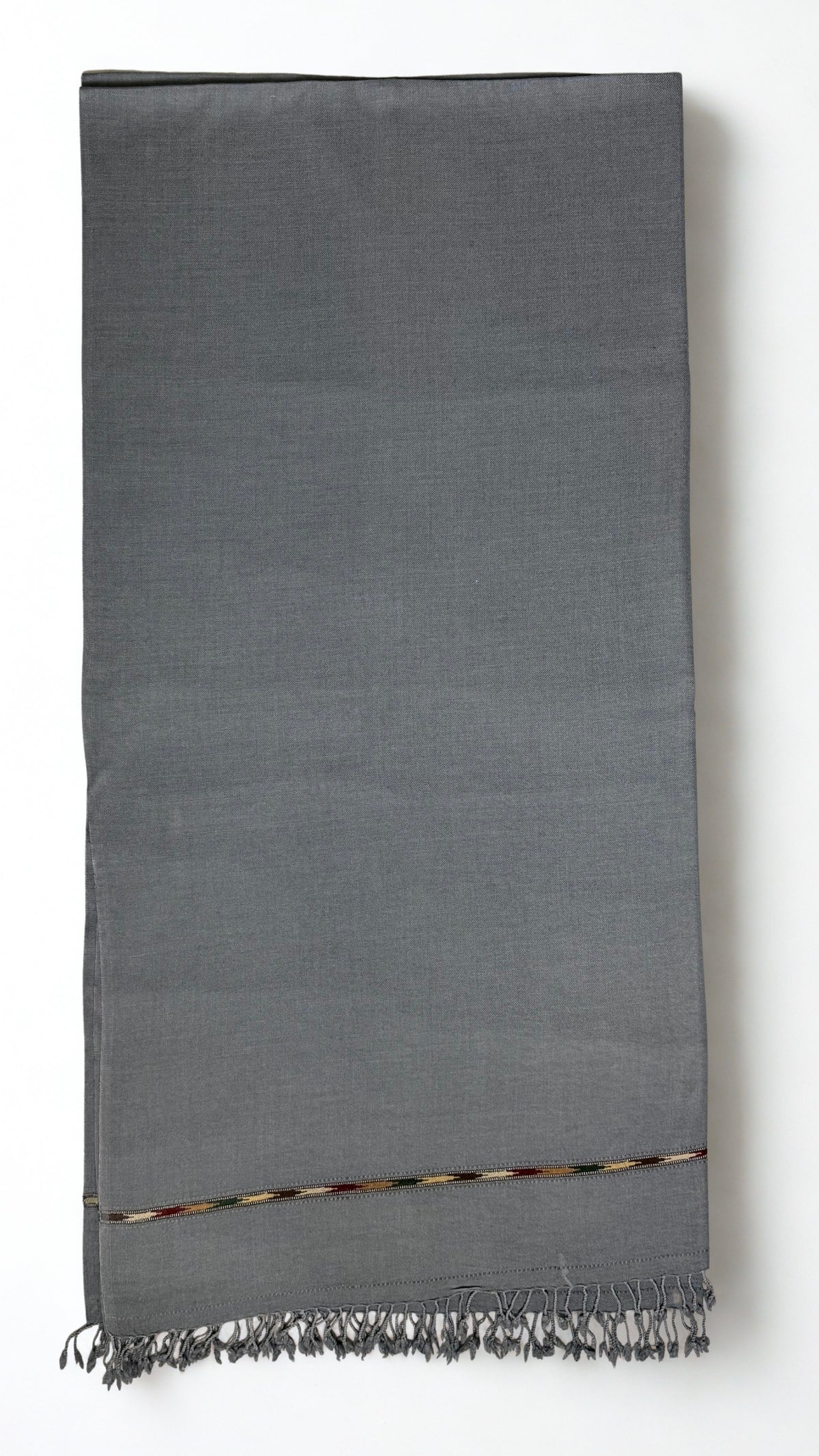 Grey men's Swati pashmina shawl folded flat, approx. 45 by 90 inches with a fringed end
