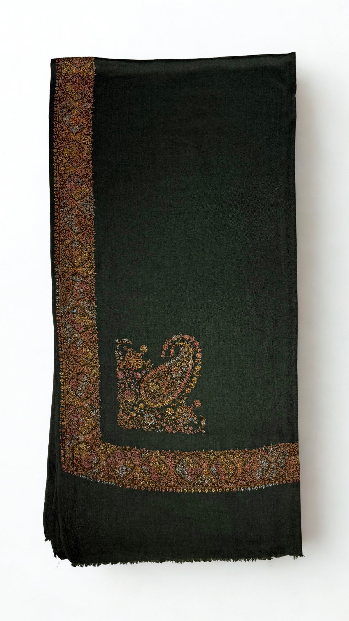 Forest green Swati Shahtoosh shawl folded flat, the hand-embroidered medallion border in gold and copper running down one edge with a large paisley at the corner