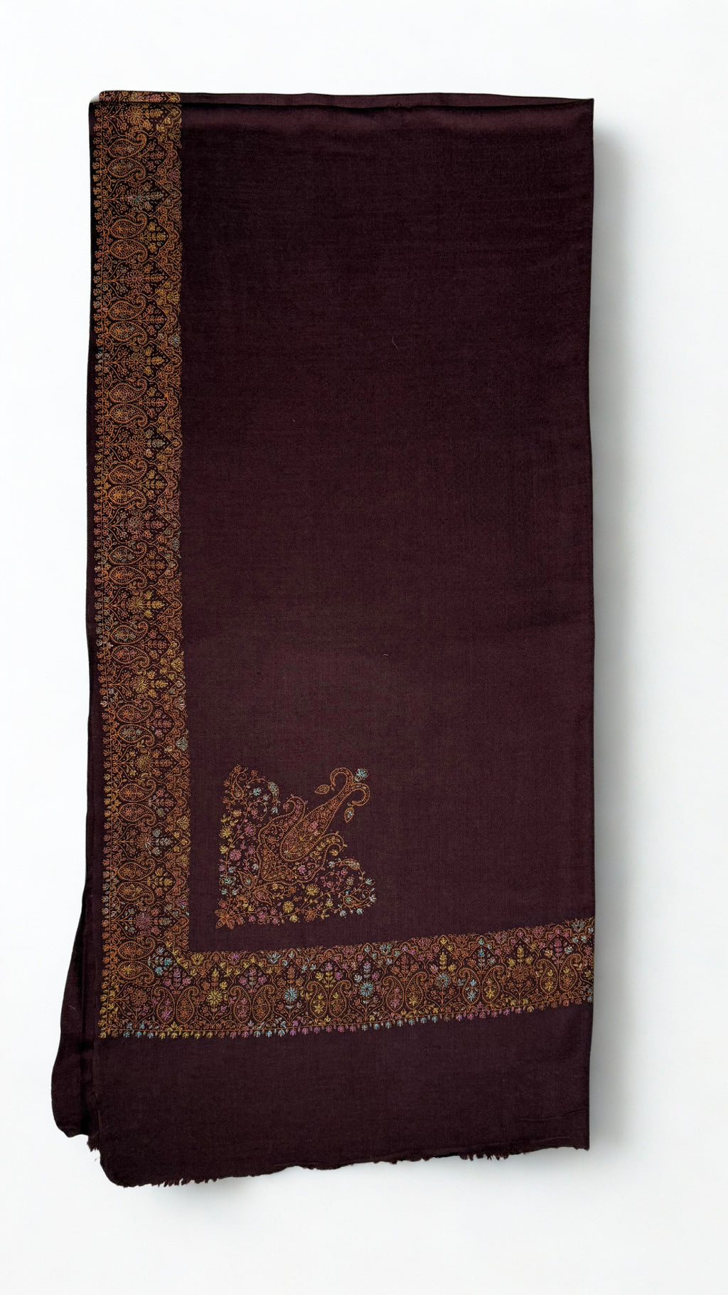 Deep maroon Swati Shahtoosh shawl folded flat, the wide gold and pastel paisley border running down one edge with a large paisley buta on the field