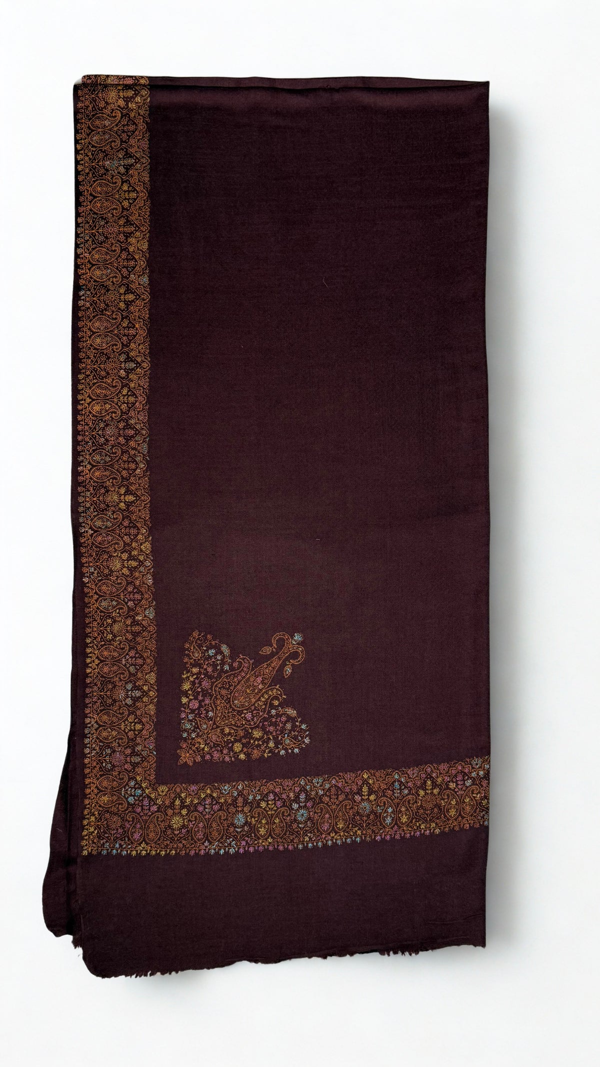 Deep maroon Swati Shahtoosh shawl folded flat, the wide gold and pastel paisley border running down one edge with a large paisley buta on the field