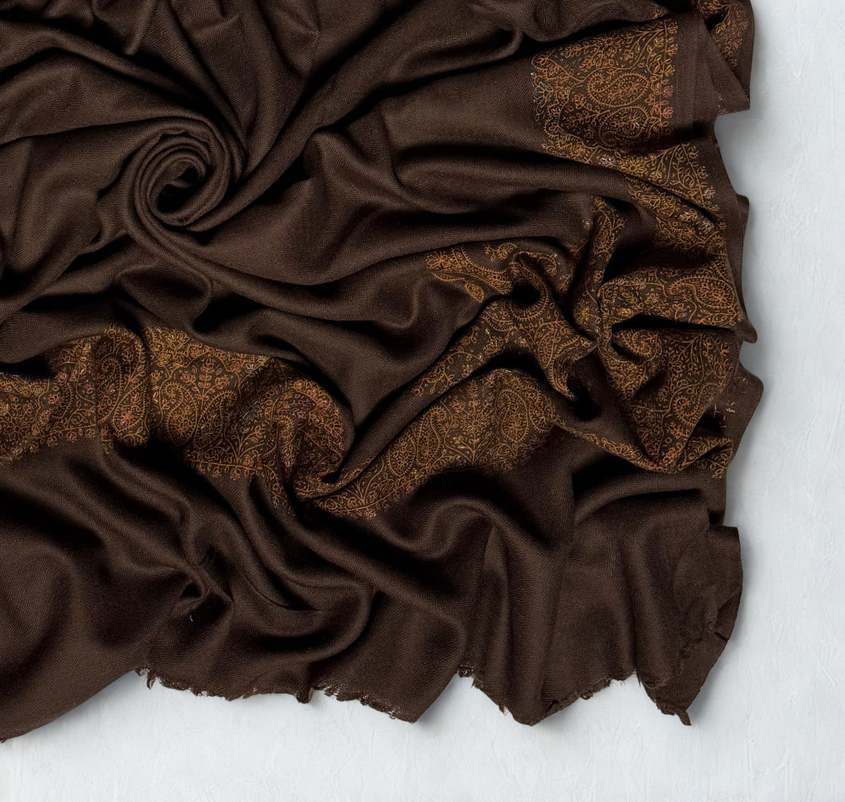 Espresso brown Swati Shahtoosh shawl, the hand-embroidered paisley border running along the edge with a row of upright buta at the end