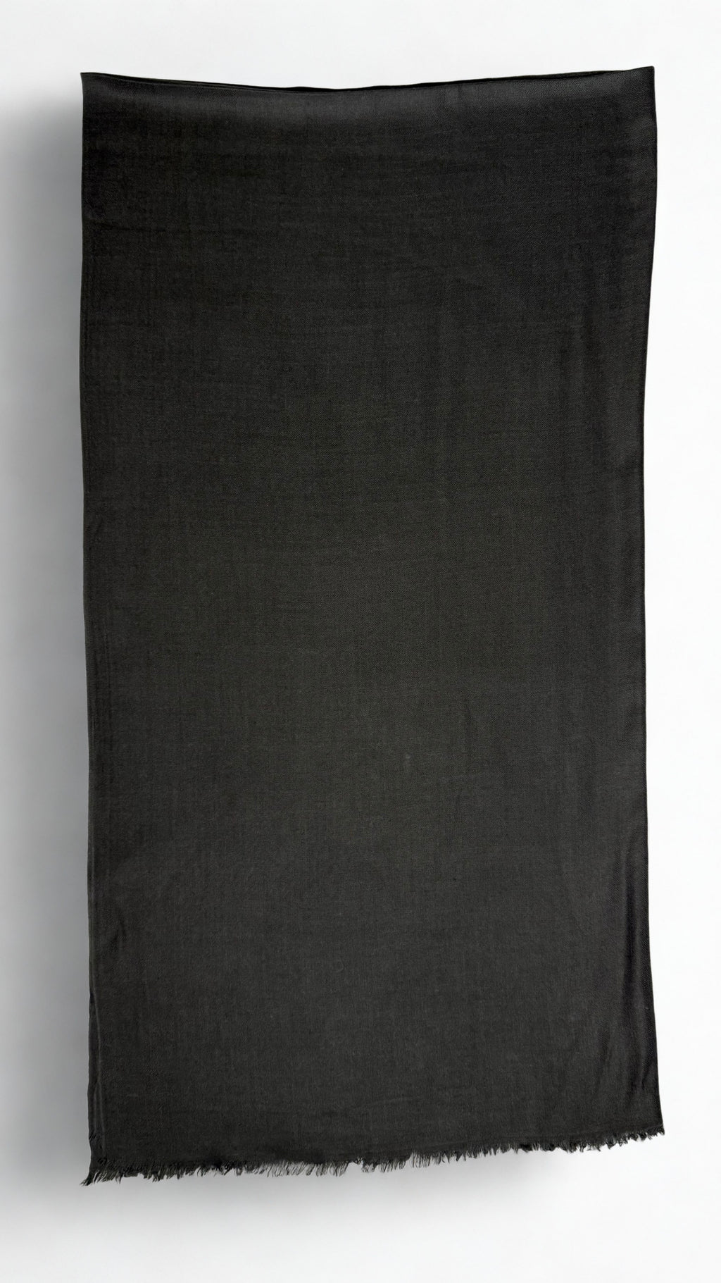 Charcoal black Swati Shahtoosh shawl folded lengthwise, showing the plain field, self-coloured diamond weave and fringed end