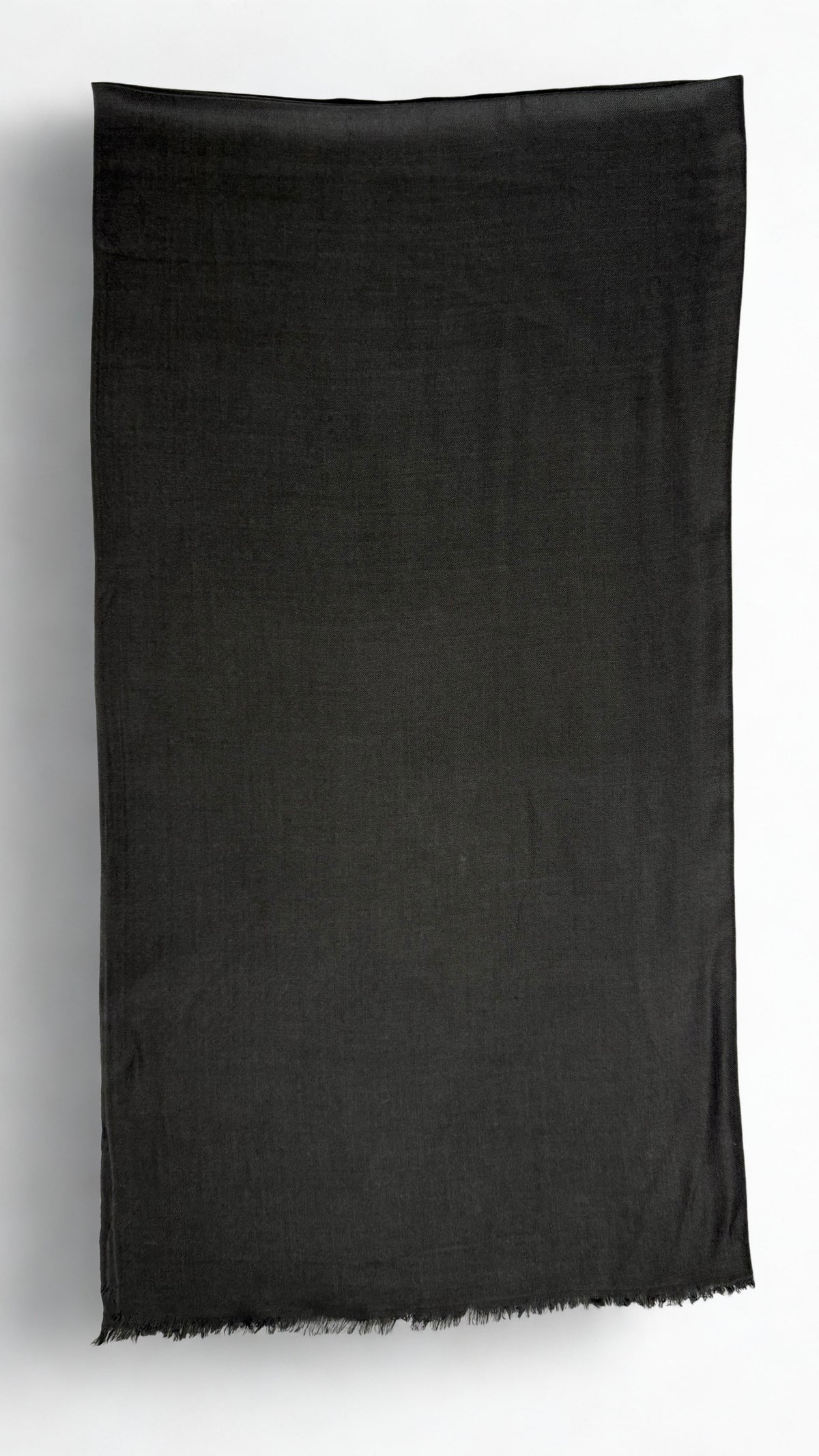 Charcoal black Swati Shahtoosh shawl folded lengthwise, showing the plain field, self-coloured diamond weave and fringed end
