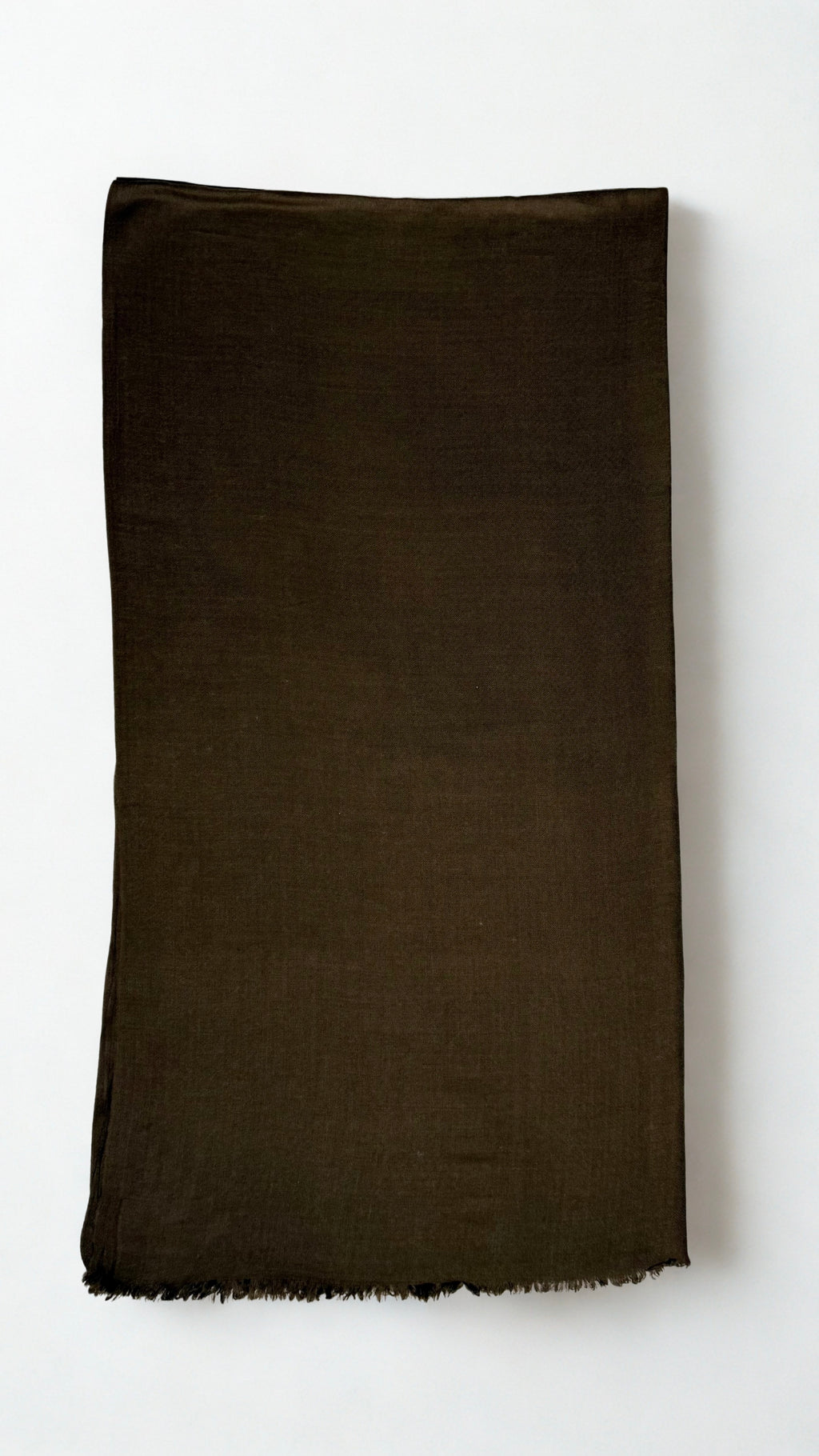 Warm brown Swati Shahtoosh shawl folded lengthwise, showing the plain field, self-coloured diamond weave and fringed end