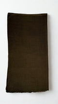 Warm brown Swati Shahtoosh shawl folded lengthwise, showing the plain field, self-coloured diamond weave and fringed end