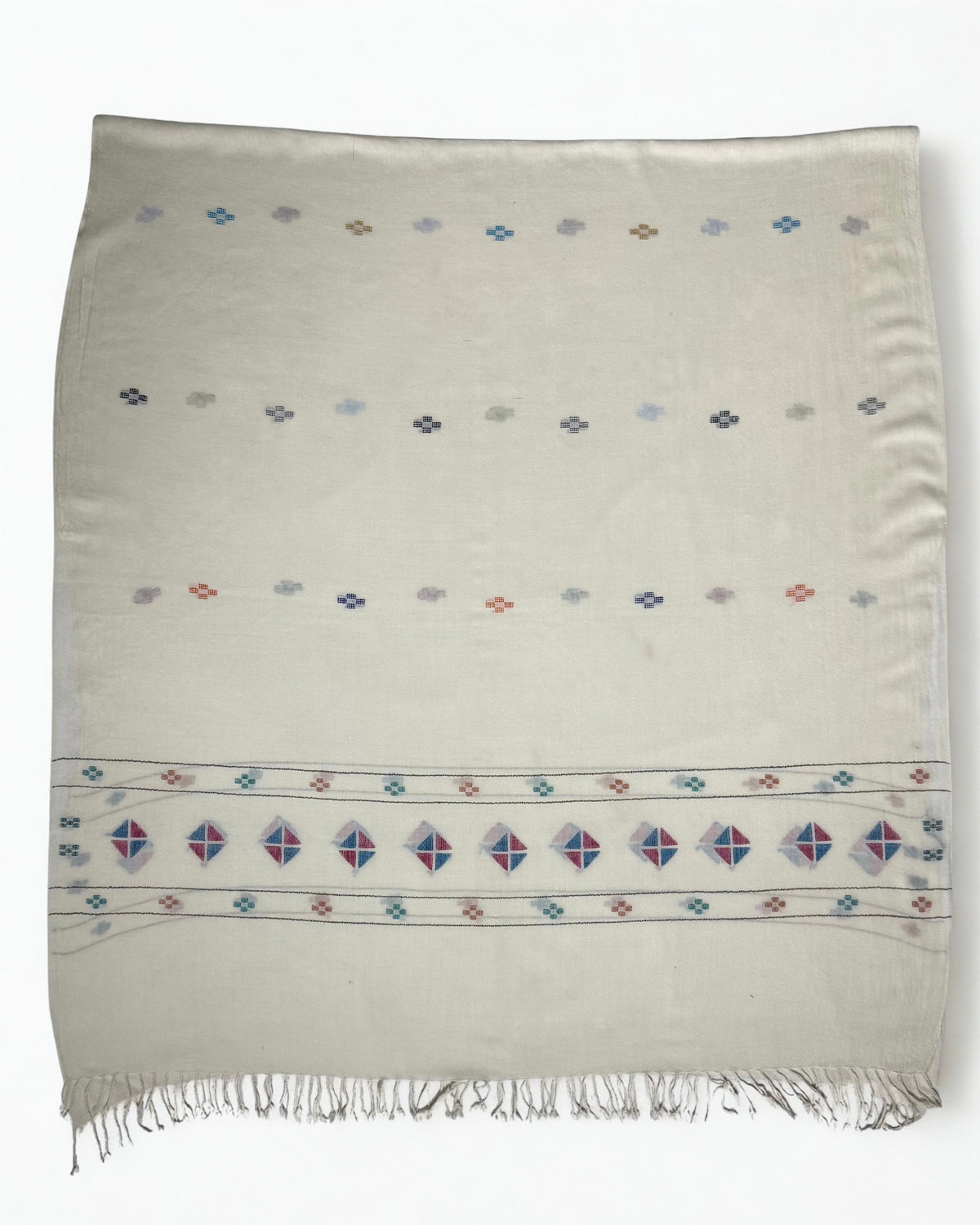 Off-white Khadi Swati Shahtoosh shawl laid flat, with rows of woven buti across the field and a diamond medallion border above the twisted fringe