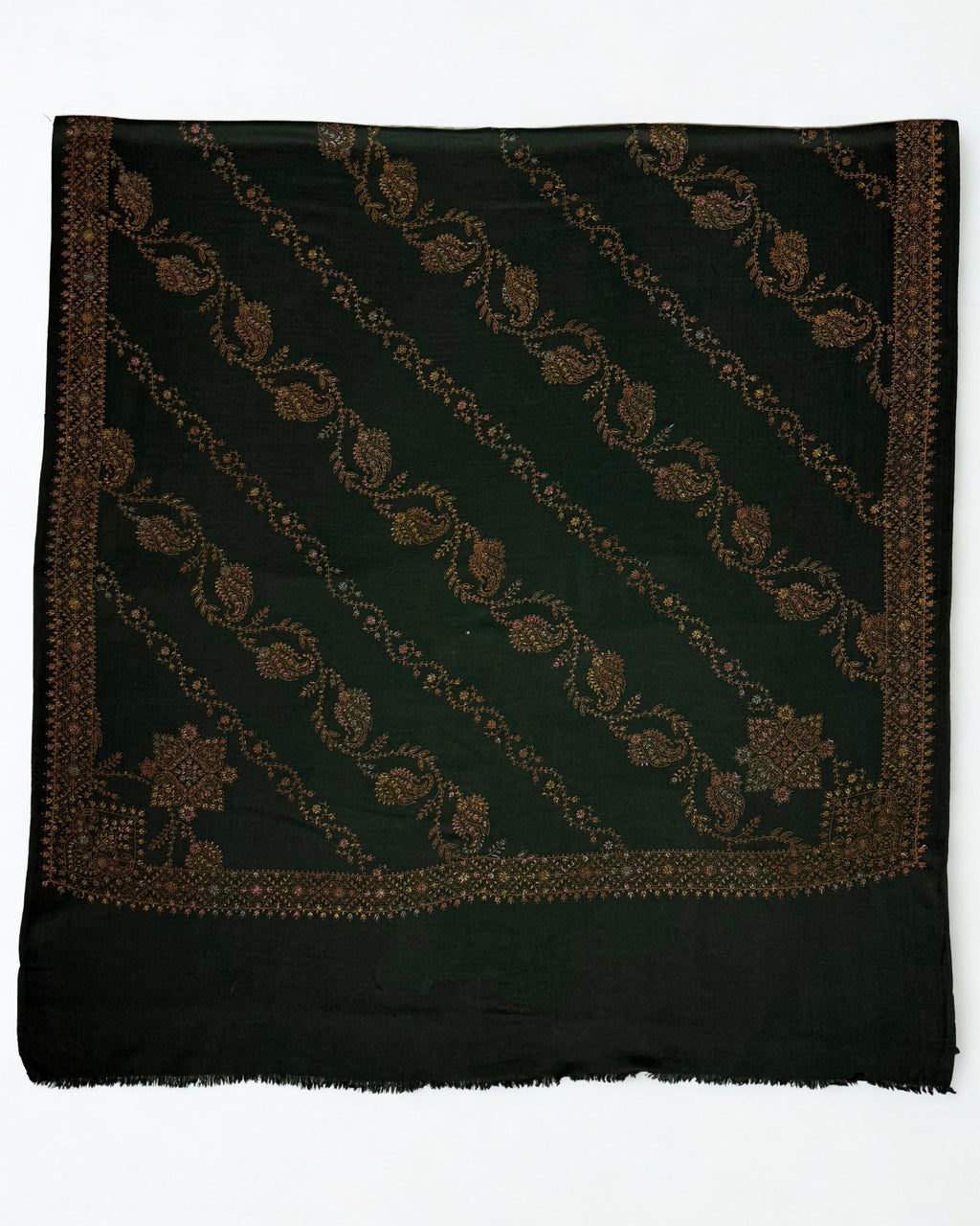 Forest green Swati Shahtoosh shawl laid flat, full diagonal paisley jaal in copper, gold and rose with two embroidered corner medallions and border