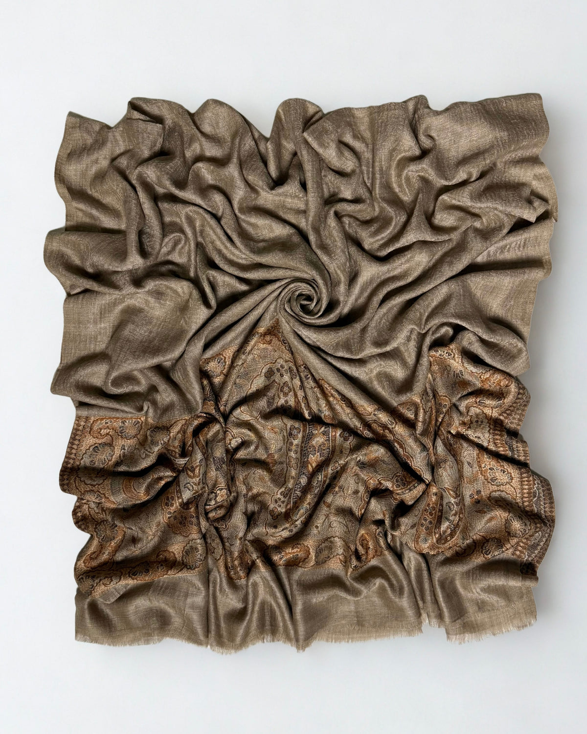 Warm khaki fine pashmina ring shawl swirled from above, the plain field over the copper paisley palla