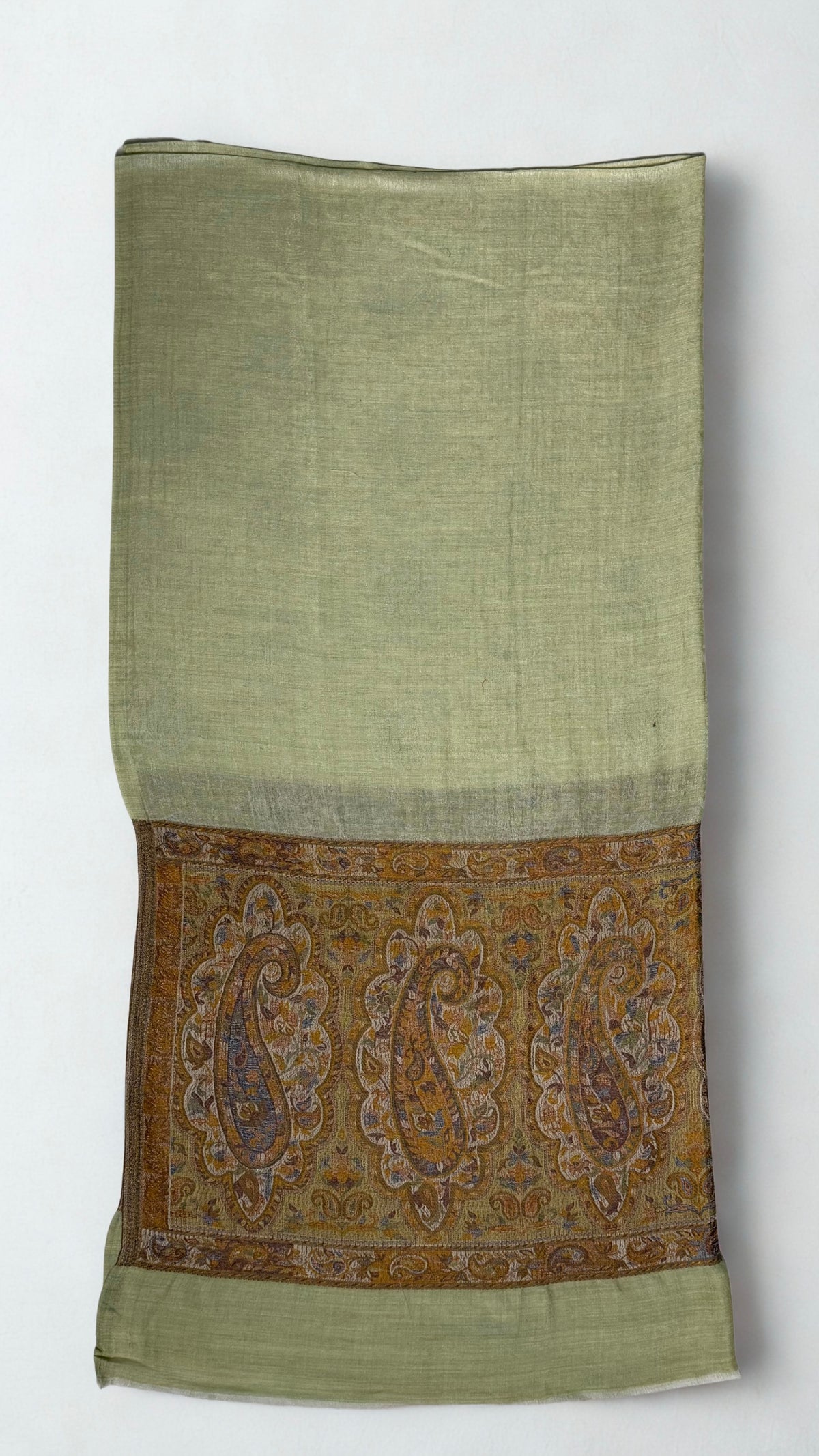Pistachio pashmina ring shawl folded, showing the bronze palla with large paisleys in scalloped medallions
