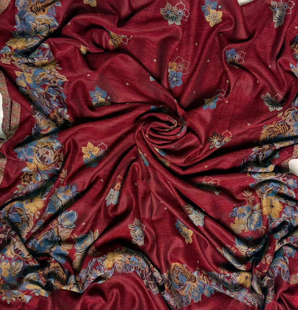 Claret Kani pashmina shawl folded back to show the reverse of the woven rose border and the fringed edge