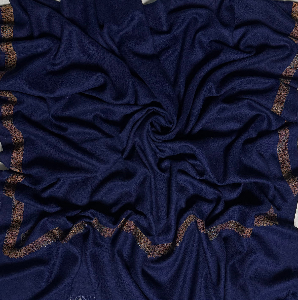 Navy Swati Shahtoosh shawl with a hand-embroidered antique gold border on a plain field