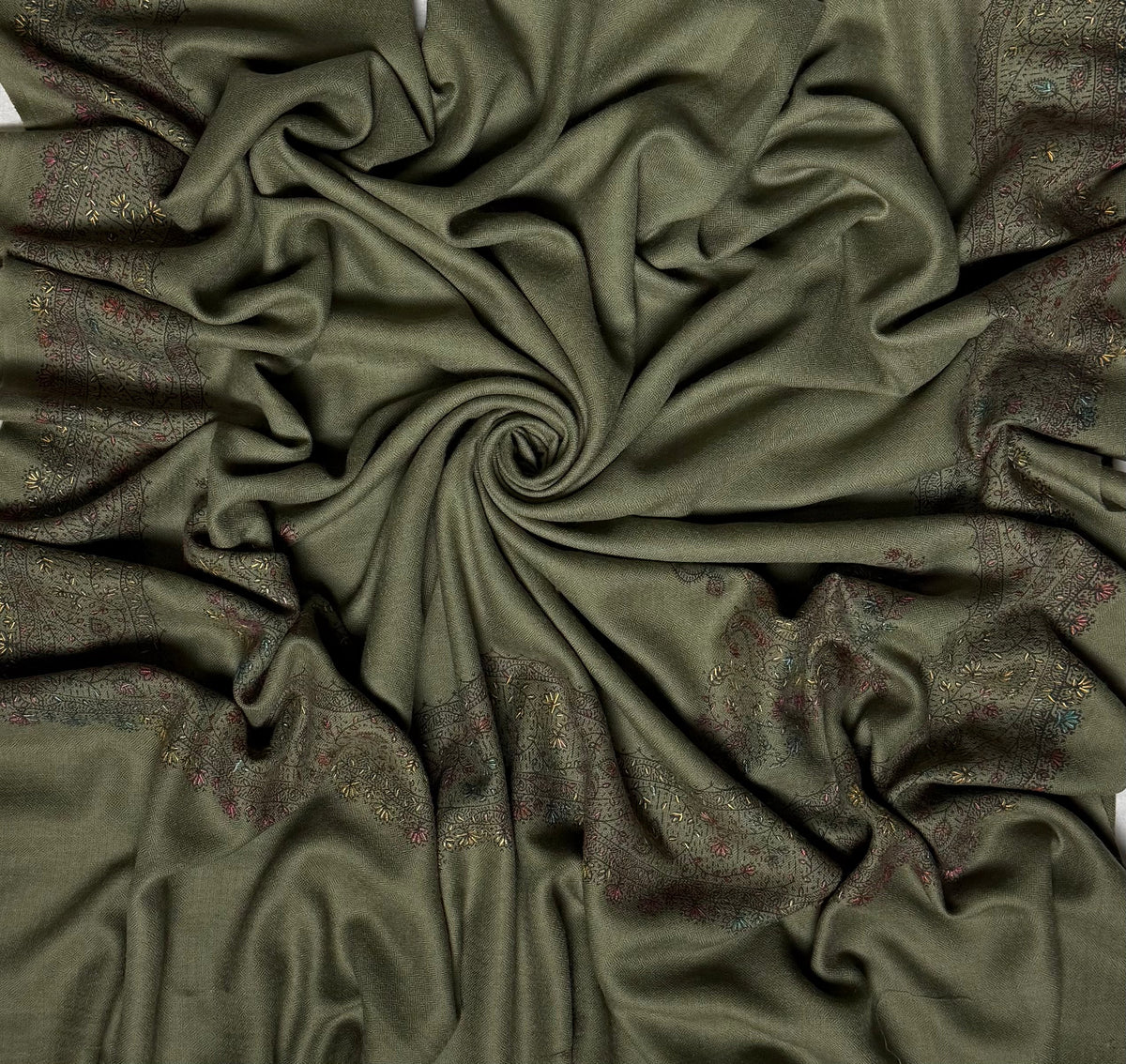 Olive green Swati Shahtoosh shawl with a hand-embroidered floral border on a plain field