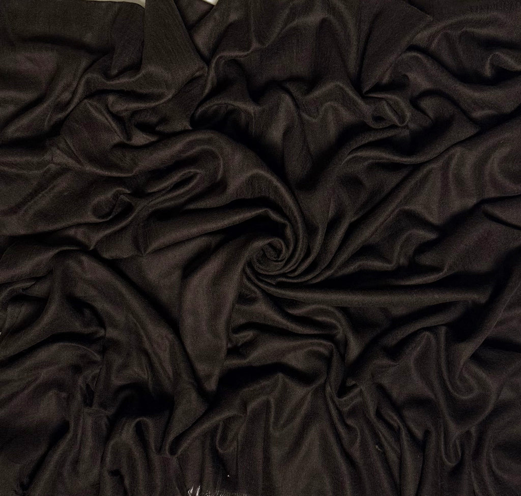 Close view of the espresso brown Swati Shahtoosh shawl, showing the self-coloured diamond weave and fringed end
