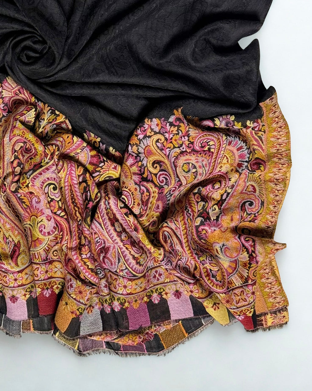 Black ek rukh Palladar shawl folded to show both patterned ends and the coloured block edging
