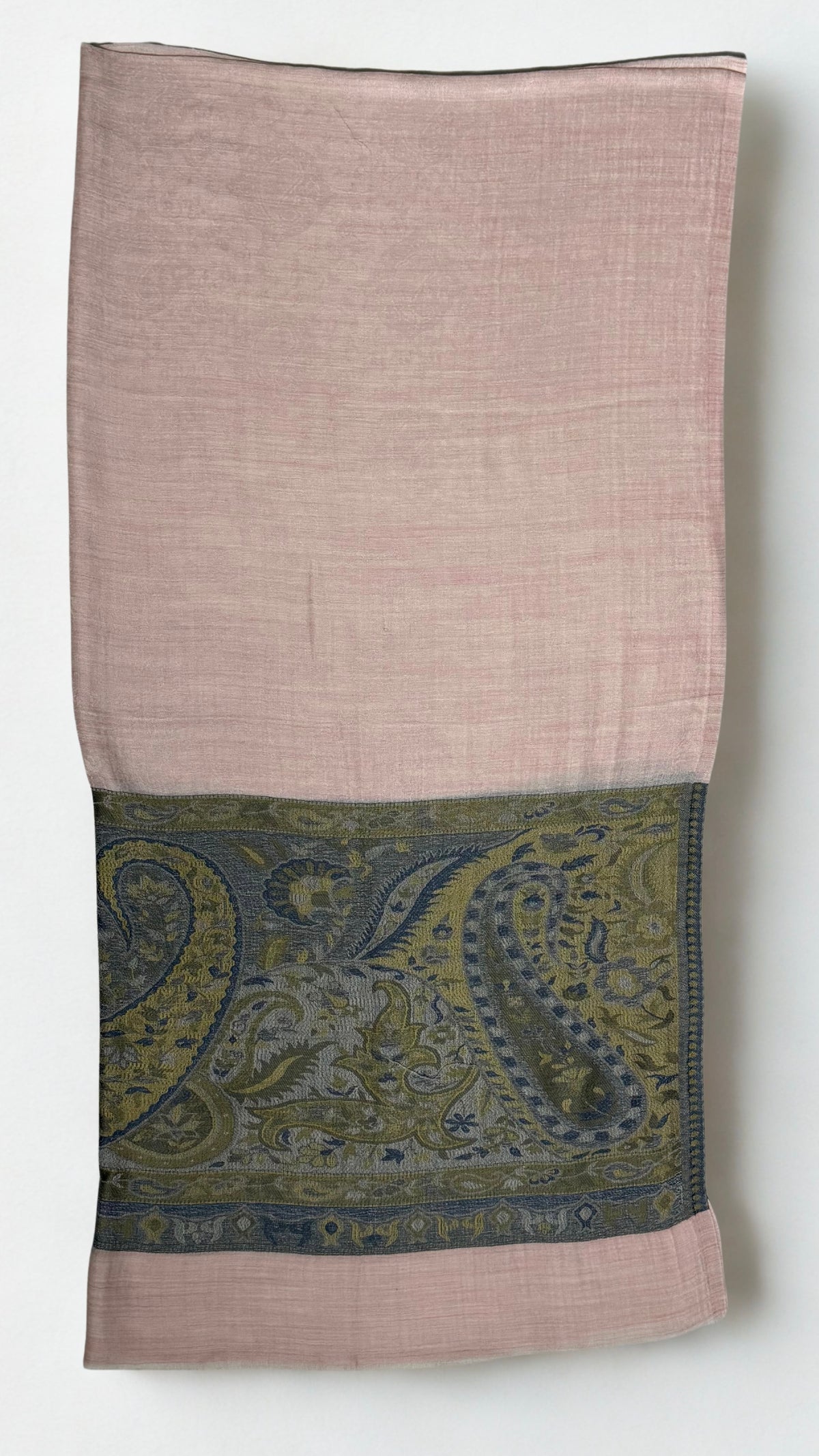 Blush pink Palladar ring shawl folded flat, the broad woven paisley palla in olive, moss and indigo across the lower end