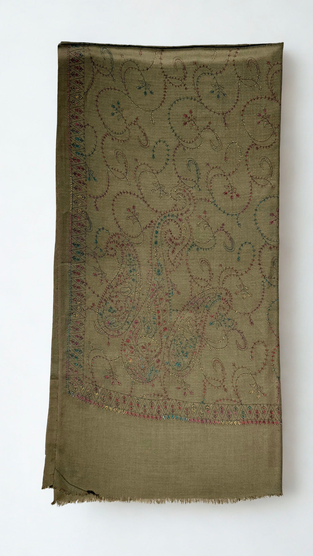 Olive brown Swati Shahtoosh shawl folded lengthwise, showing the large end paisleys and the narrow toothed border in rose, teal and gold