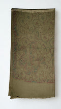Olive brown Swati Shahtoosh shawl folded lengthwise, showing the large end paisleys and the narrow toothed border in rose, teal and gold