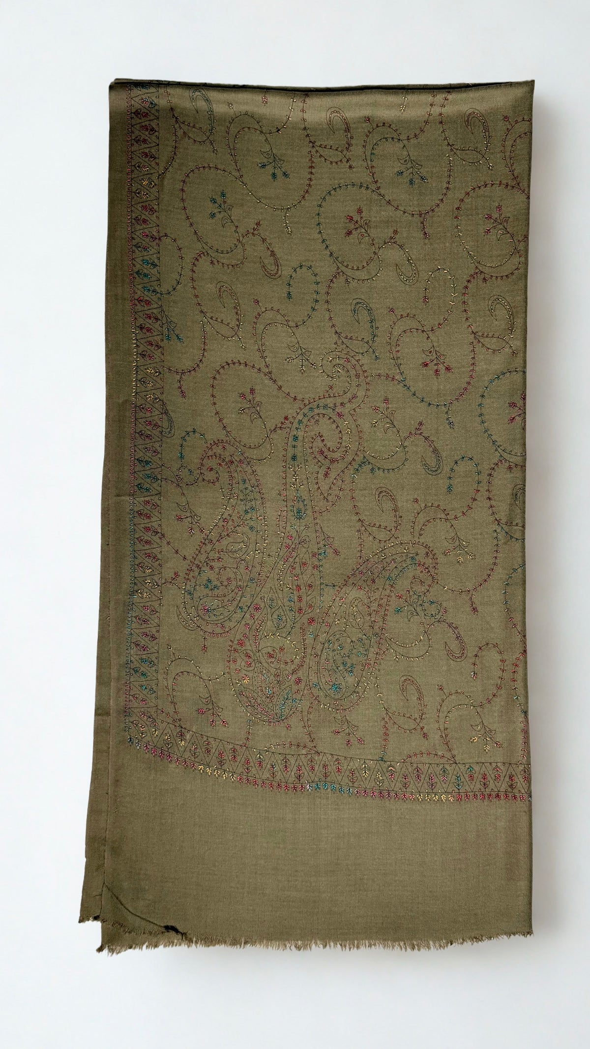 Olive brown Swati Shahtoosh shawl folded lengthwise, showing the large end paisleys and the narrow toothed border in rose, teal and gold