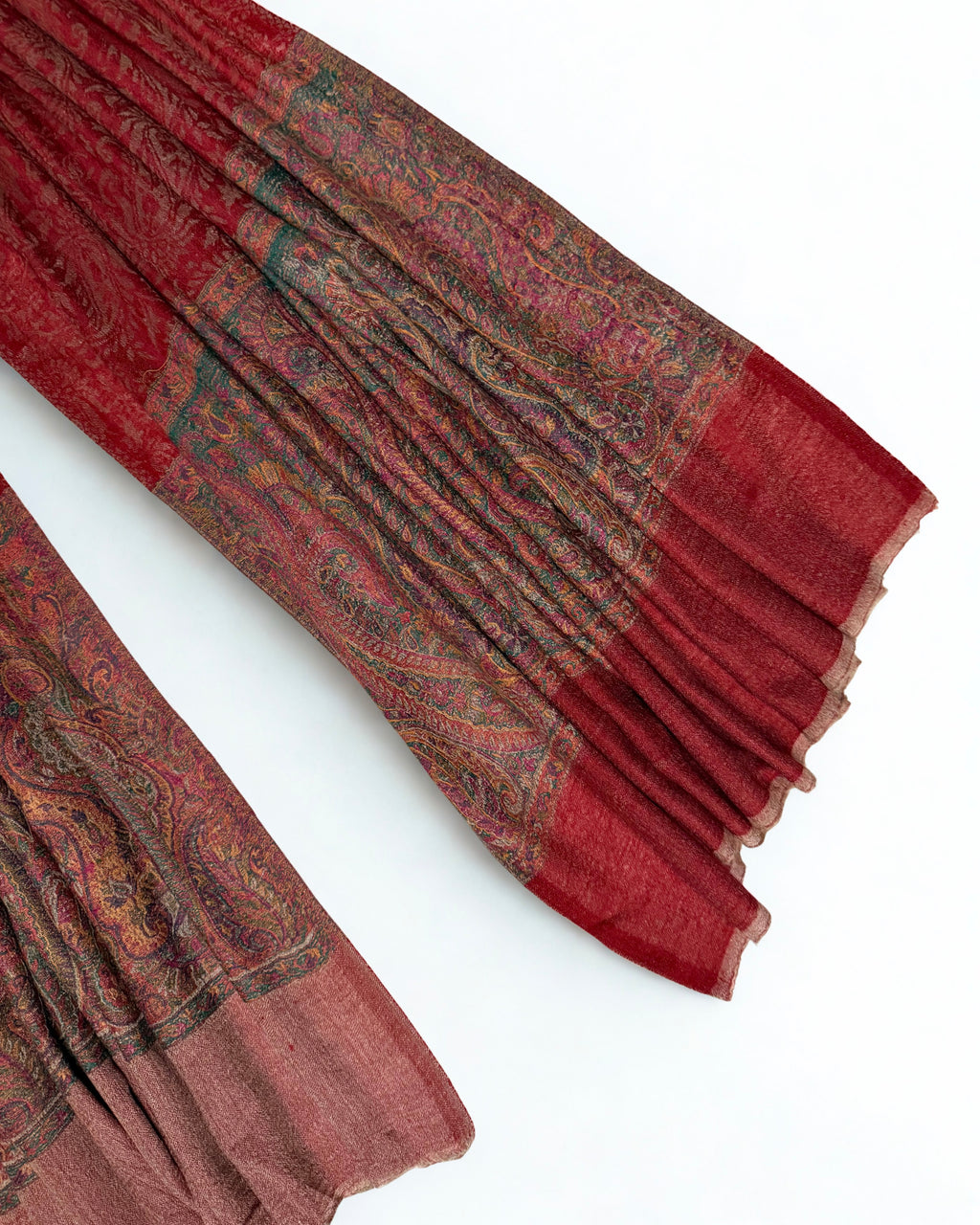 Detail of the curved paisley butas filled with smaller flowers along the end panel