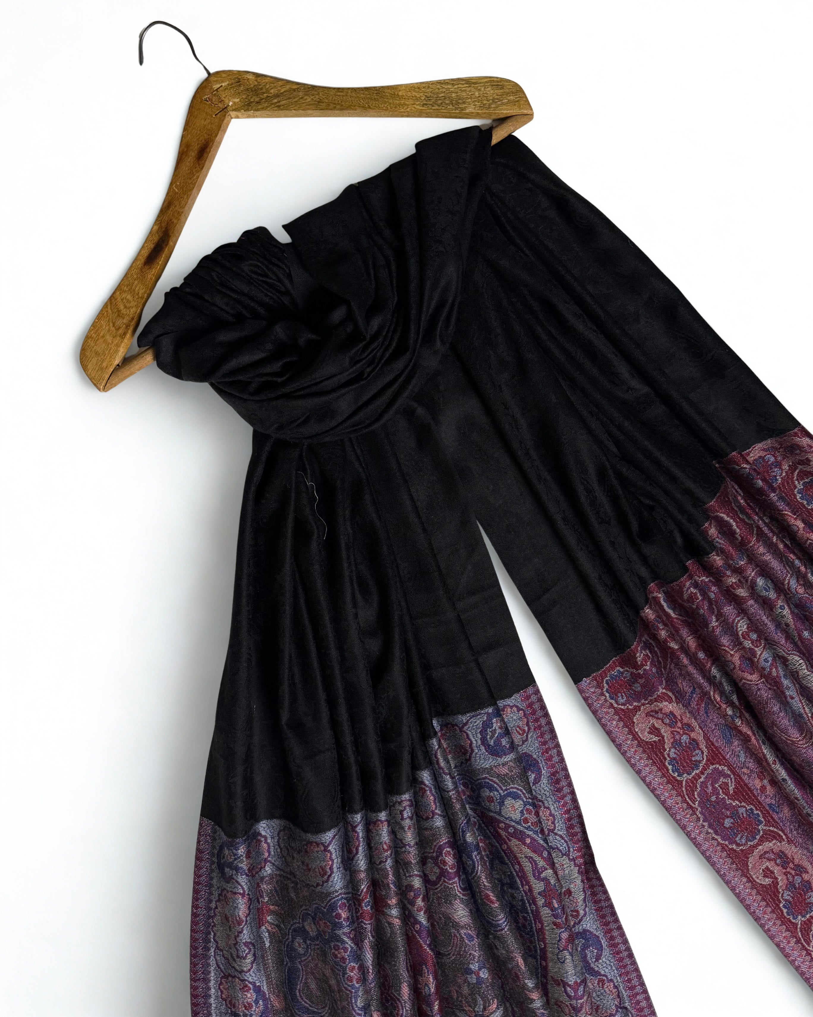 Self-patterned paisley woven into the black ground in the same colour