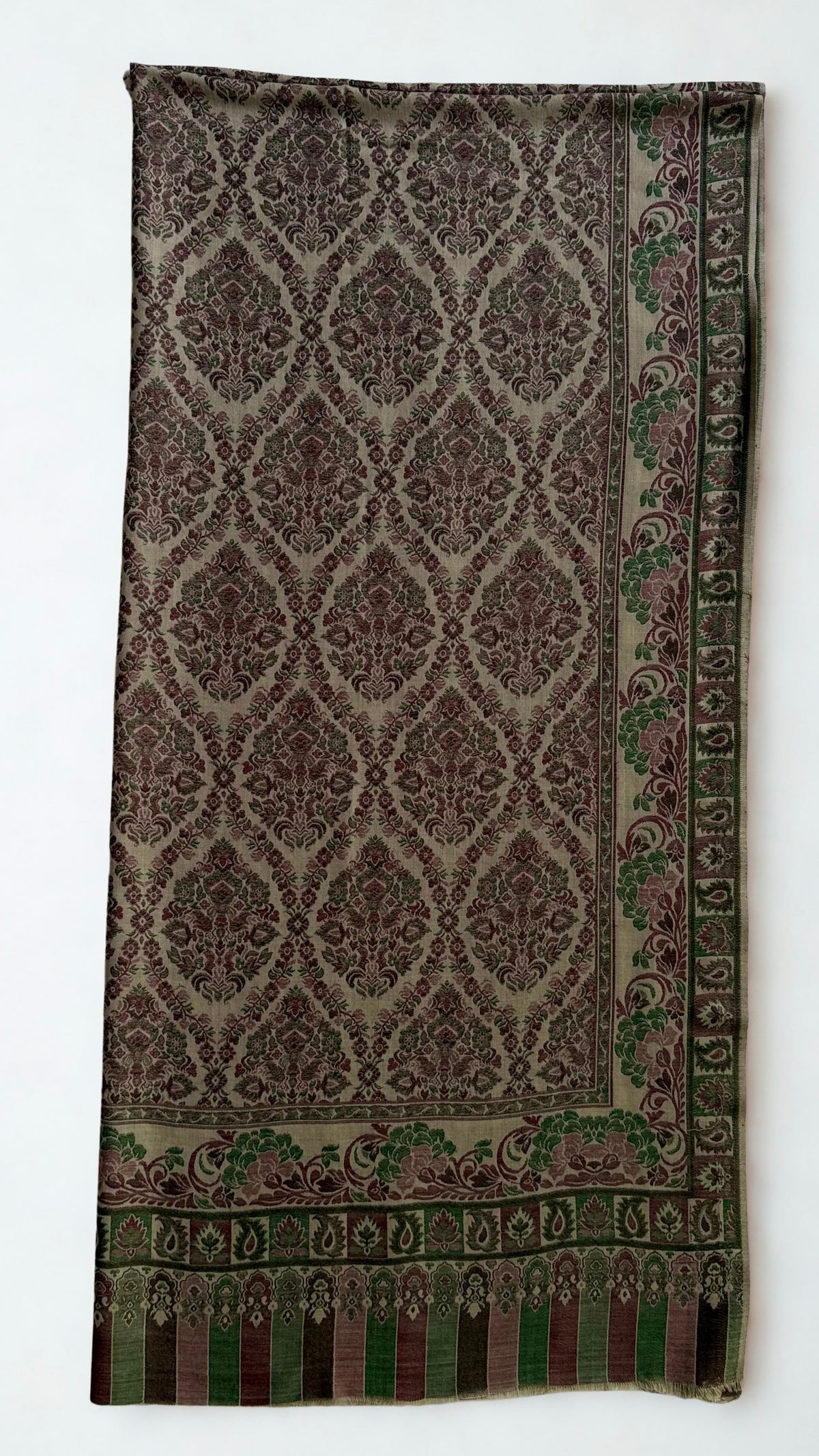Plum and moss Kani pashmina shawl folded back to show the reverse of the medallion lattice and the striped column end