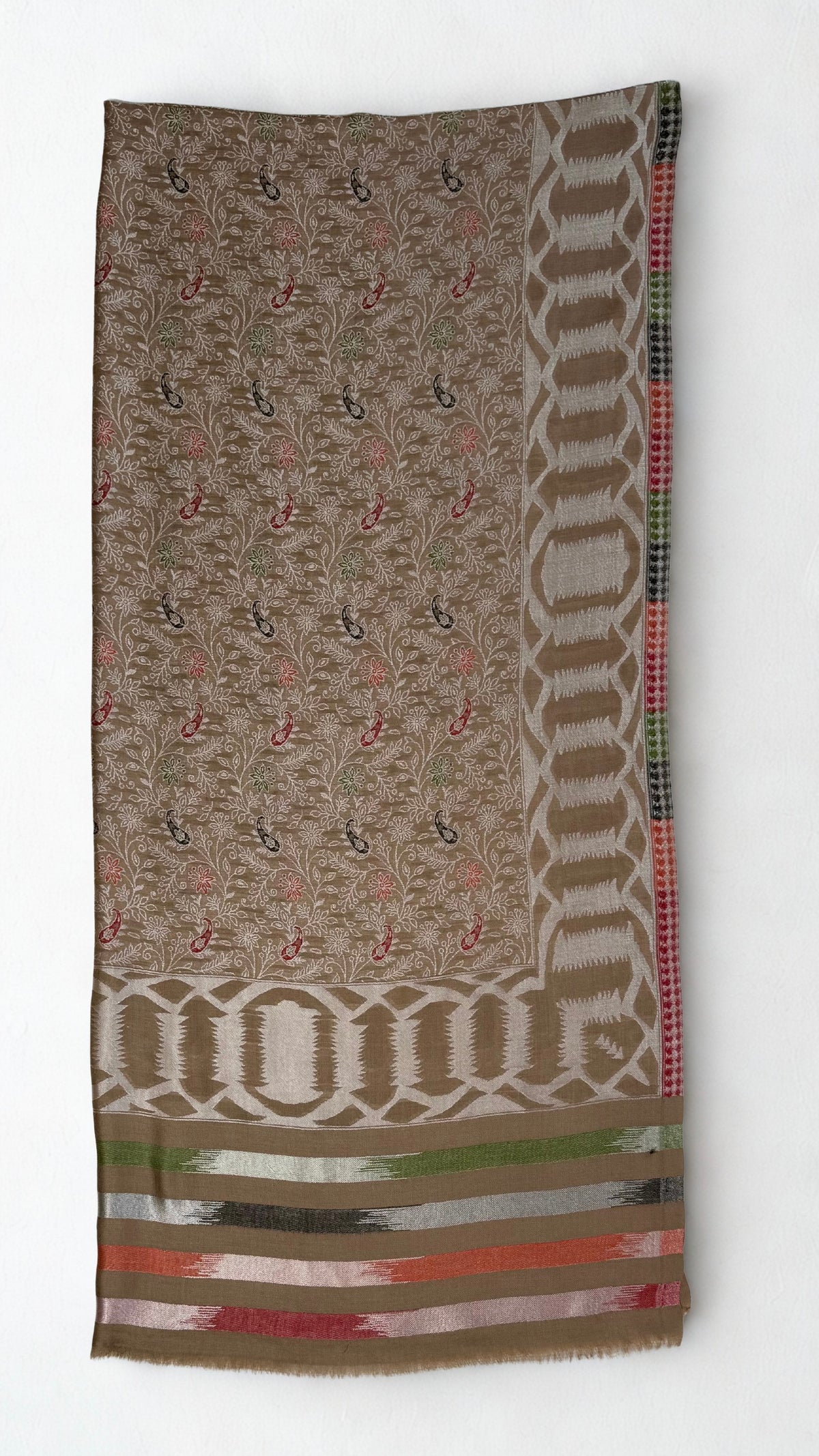 Close view of the ikat-feathered end stripes in green, coral, crimson and silver