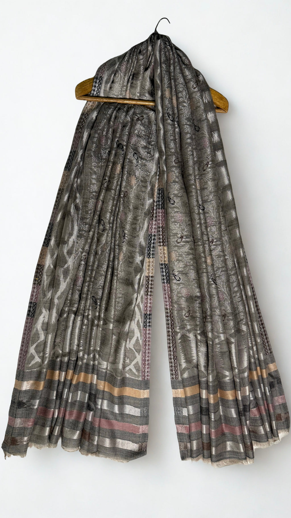 The banded end of the shawl in silver, gold, rose and charcoal with fringed edge