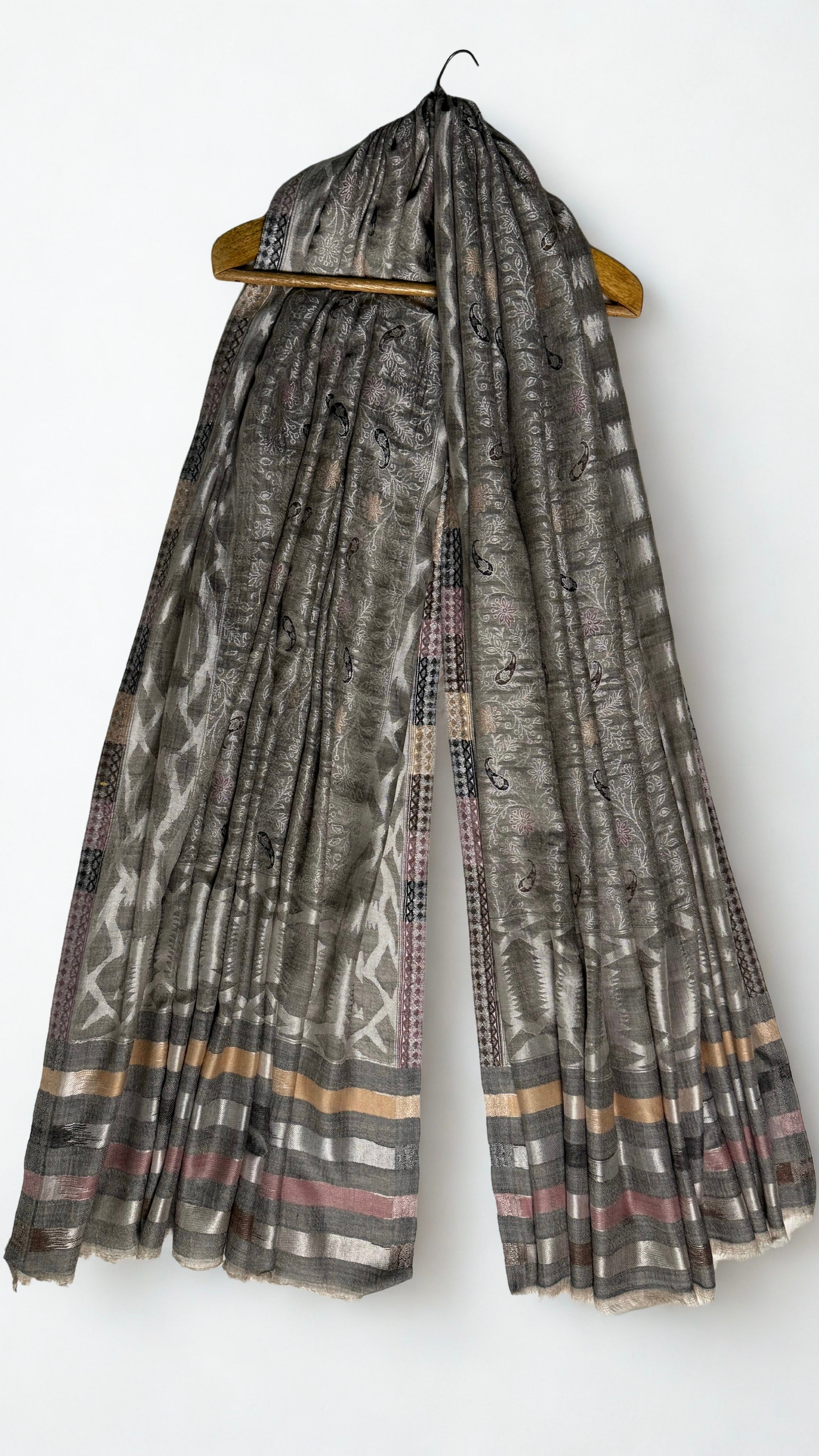 The banded end of the shawl in silver, gold, rose and charcoal with fringed edge
