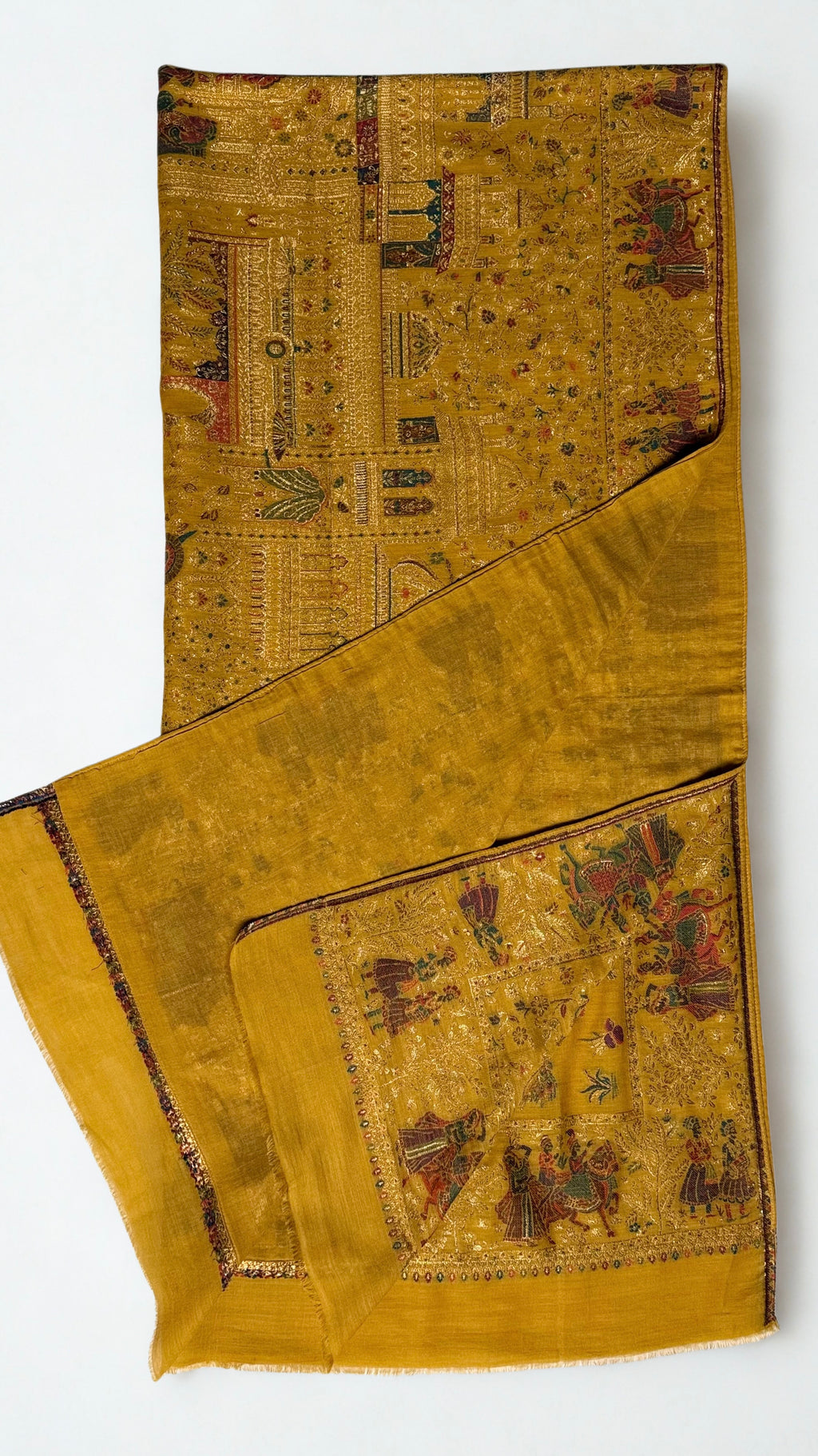 Close view of the woven Mughal procession — caparisoned elephants, riders and palace pavilions in gold zari on mustard pashmina