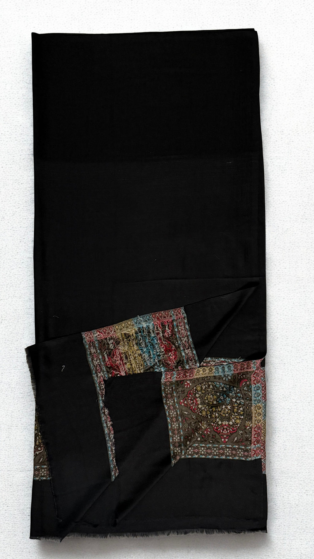 Close view of the paisley band in olive, red, turquoise, cream and saffron with narrow floral stripes
