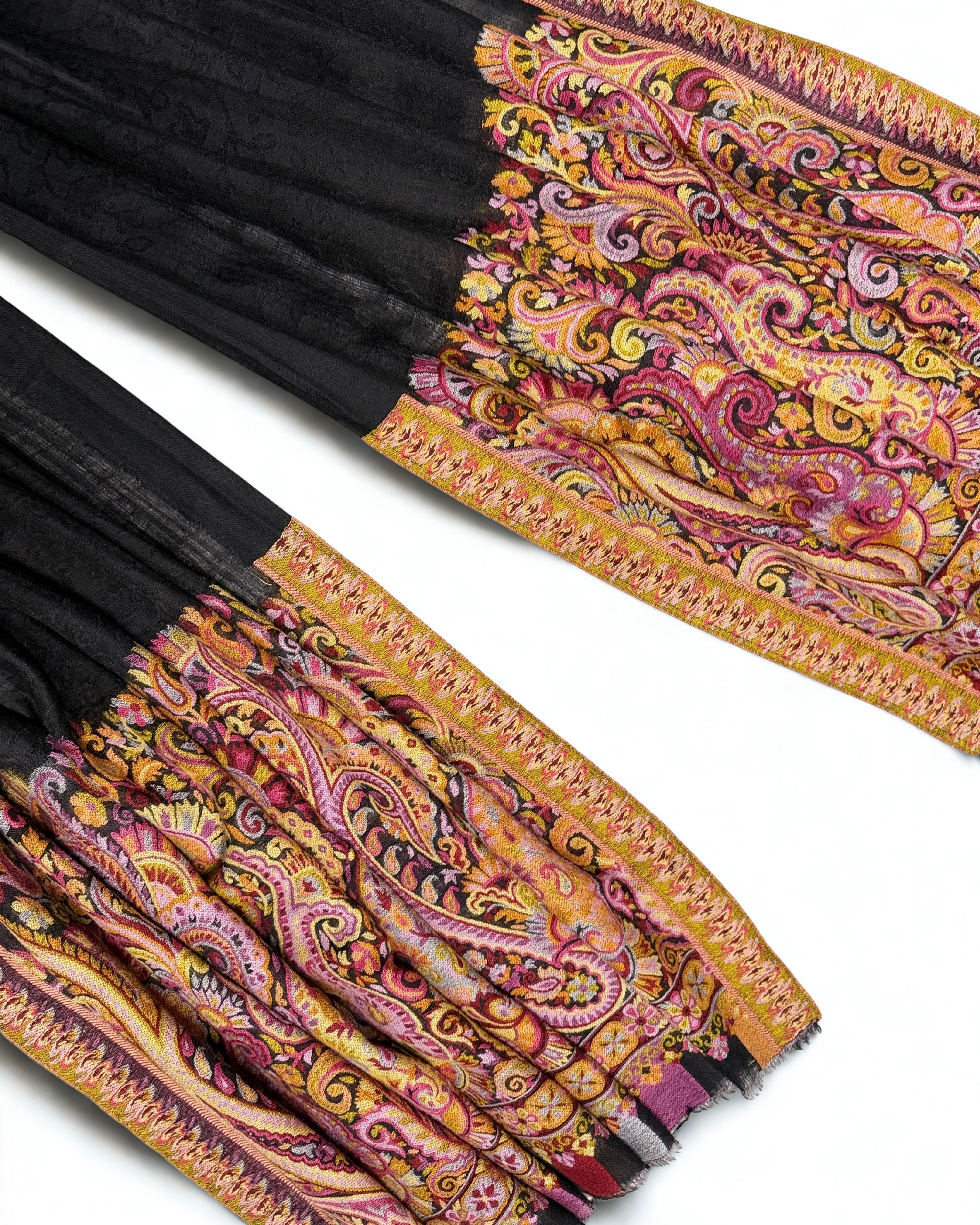 Both ek rukh end panels of a black pashmina ring shawl laid side by side, showing the paisley design and fringed edge