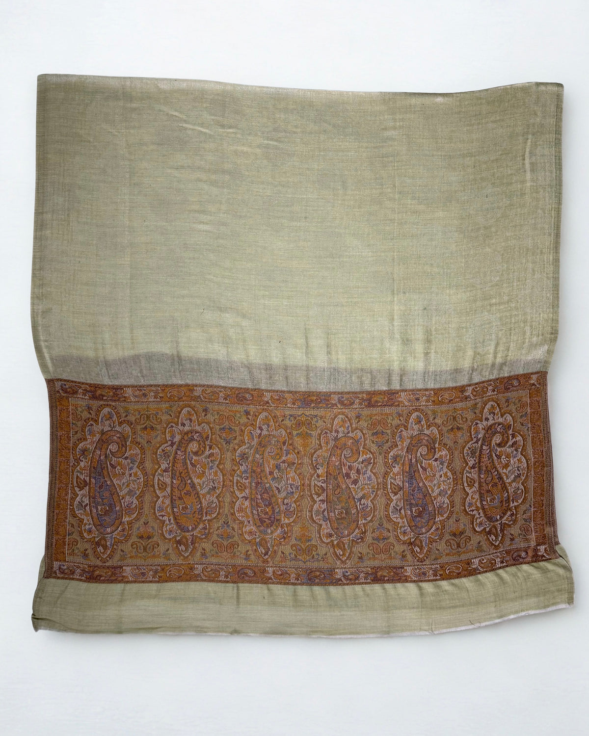 Pistachio pashmina ring shawl folded flat, showing a full row of six paisley medallions across the bronze palla