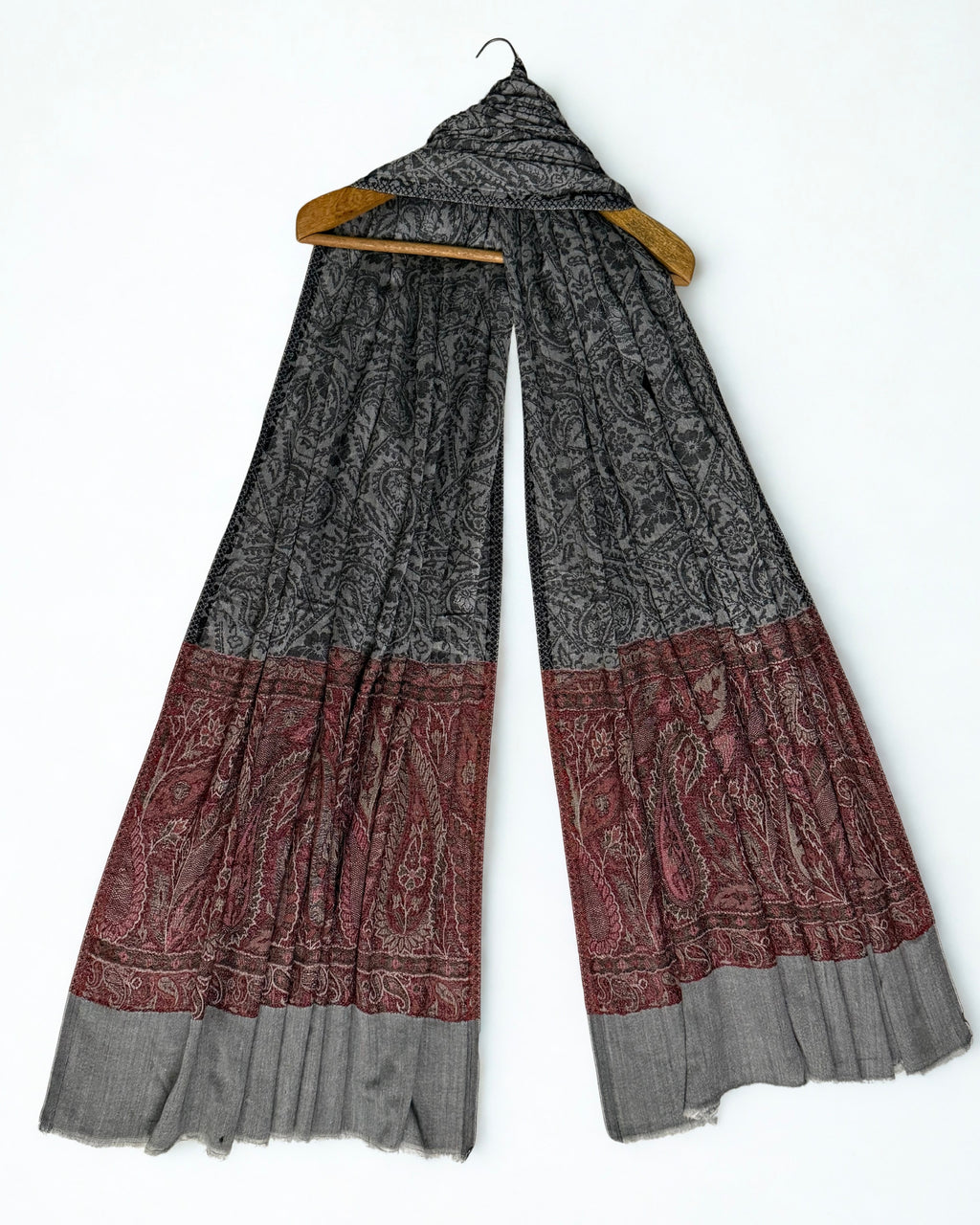 The tonal grey-on-grey paisley trellis woven across the whole charcoal field