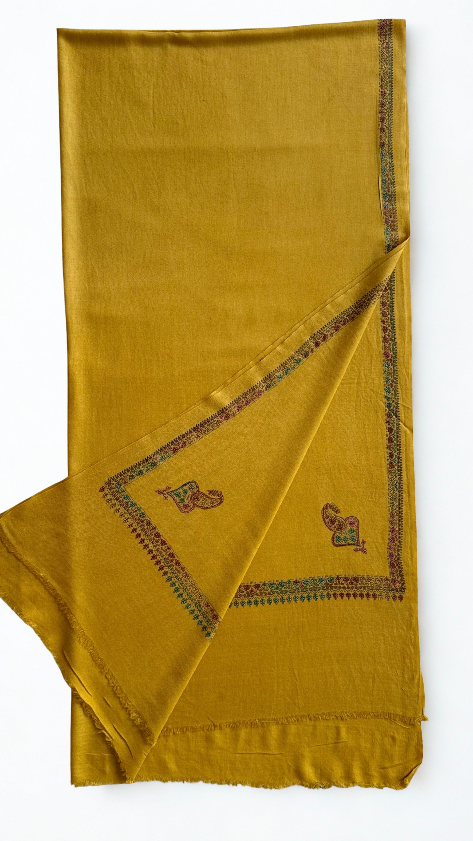 Mustard gold Swati Shahtoosh shawl in soft folds, fine sozni border and paisley corner buta on a self-woven diamond lattice ground