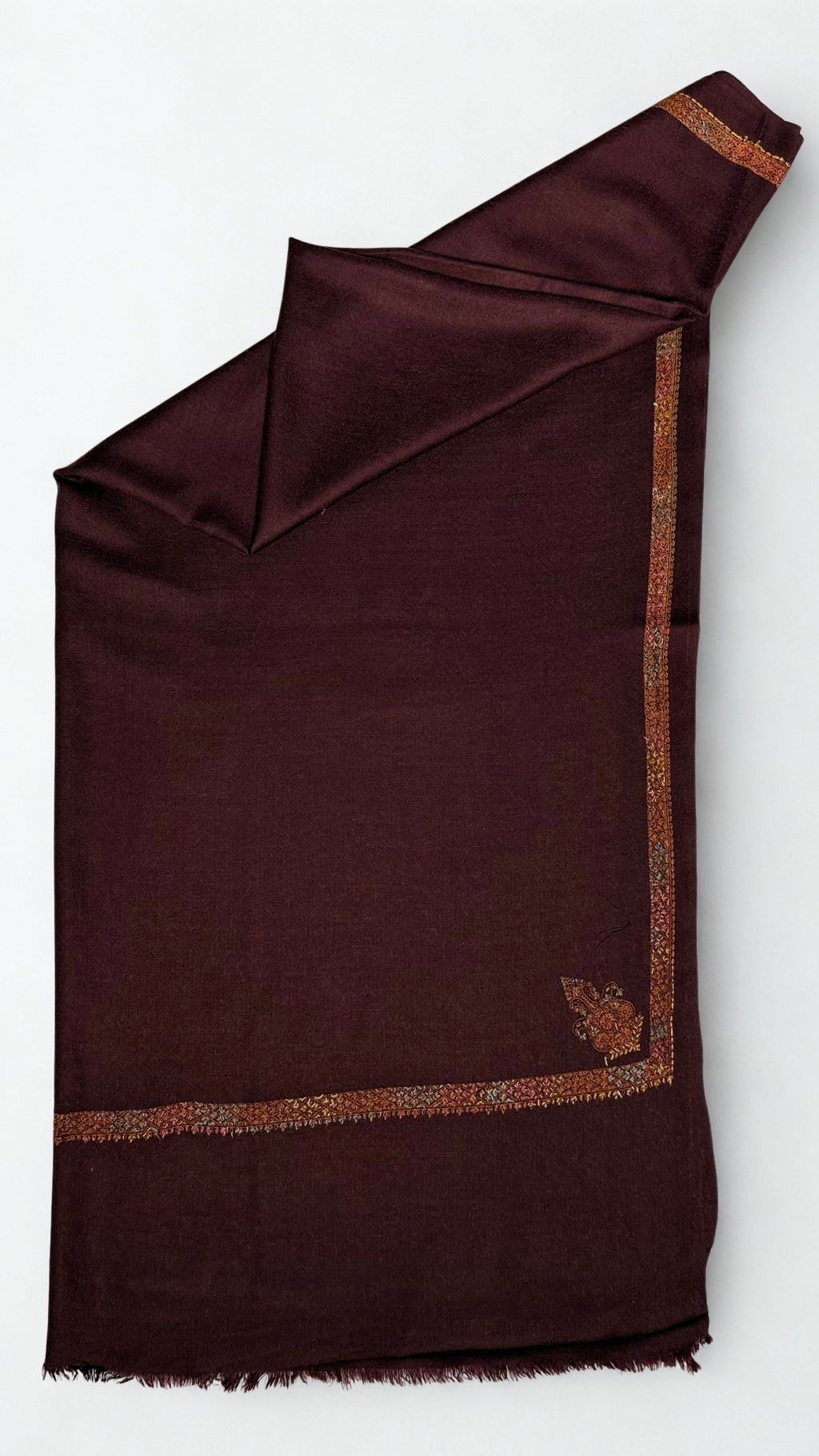 Deep maroon Swati Shahtoosh shawl folded lengthwise, gold and rust hand-embroidered border with a paisley corner buta