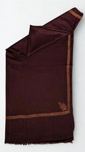 Deep maroon Swati Shahtoosh shawl folded lengthwise, gold and rust hand-embroidered border with a paisley corner buta