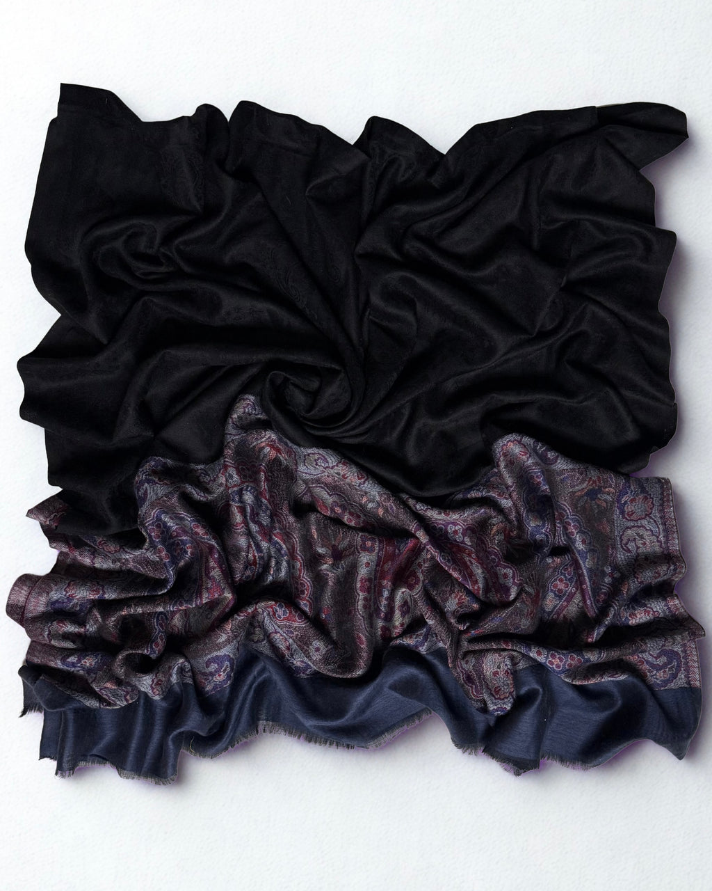 Detail of the border meeting the black ground, with the fringed slate blue edge below